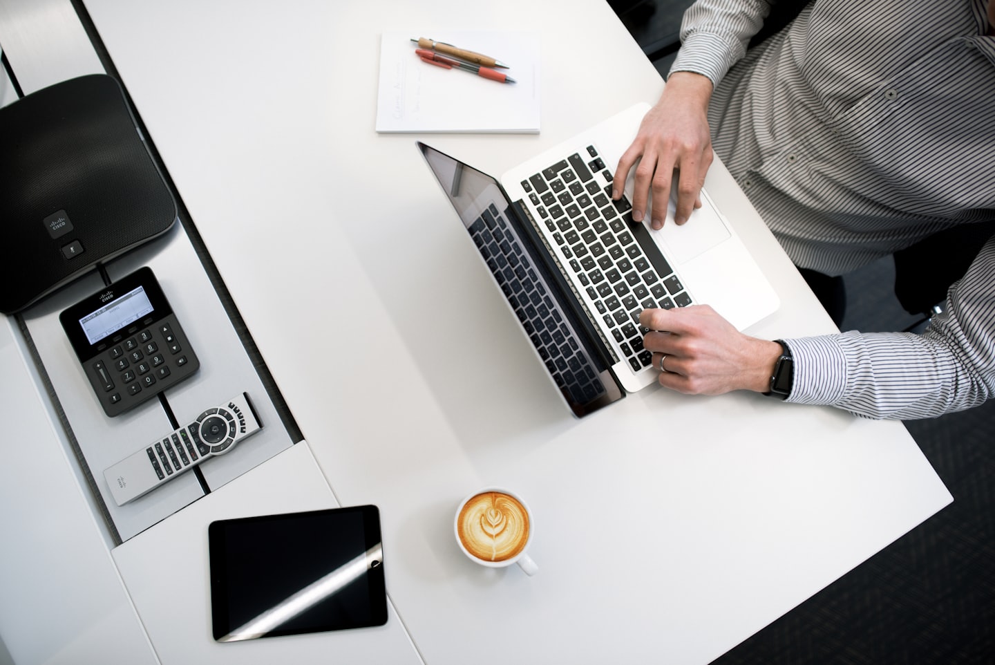 Person working on laptop at desk